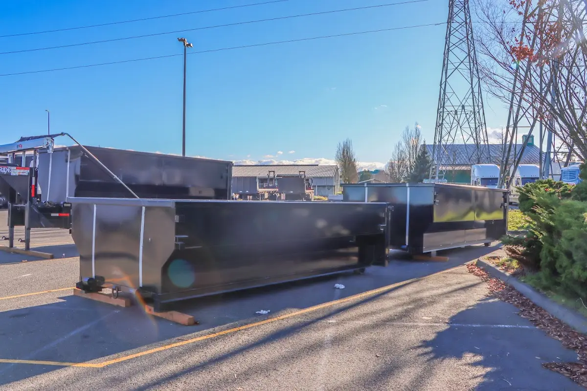 Roll-off dumpster ready for waste disposal at job site for Concrete Dumpster Rental in Vernon